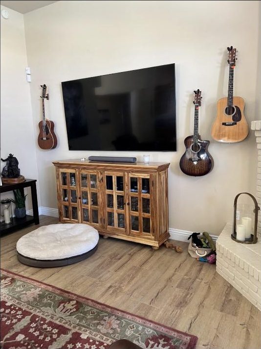 Wall-mounted TV and soundbar installed in a Bakersfield home music room