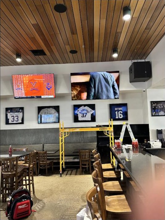Ceiling speakers and displays installed by Kalieb Designs at a Bakersfield restaurant