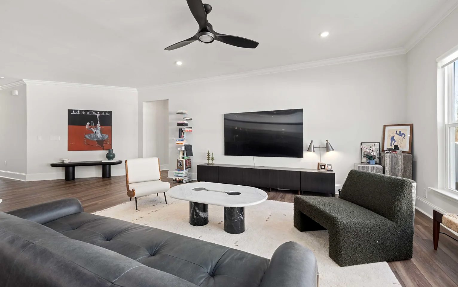 Samsung Frame TV displaying artwork, mounted flush to the wall like a framed picture